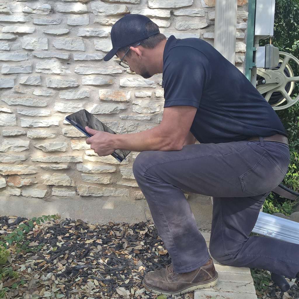 Home inspector examining the home's foundation for structural issues